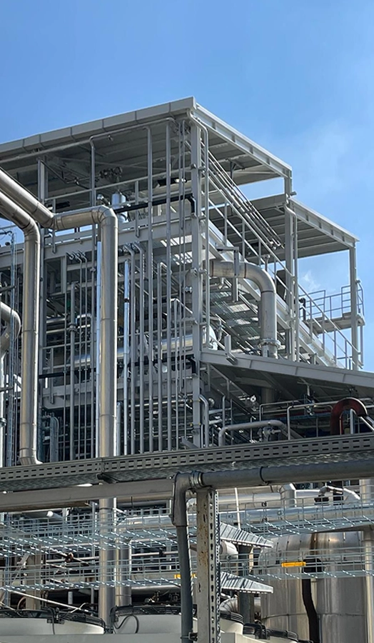 Struttura metallica e impianto industriale con tubazioni in acciaio realizzato da COIM