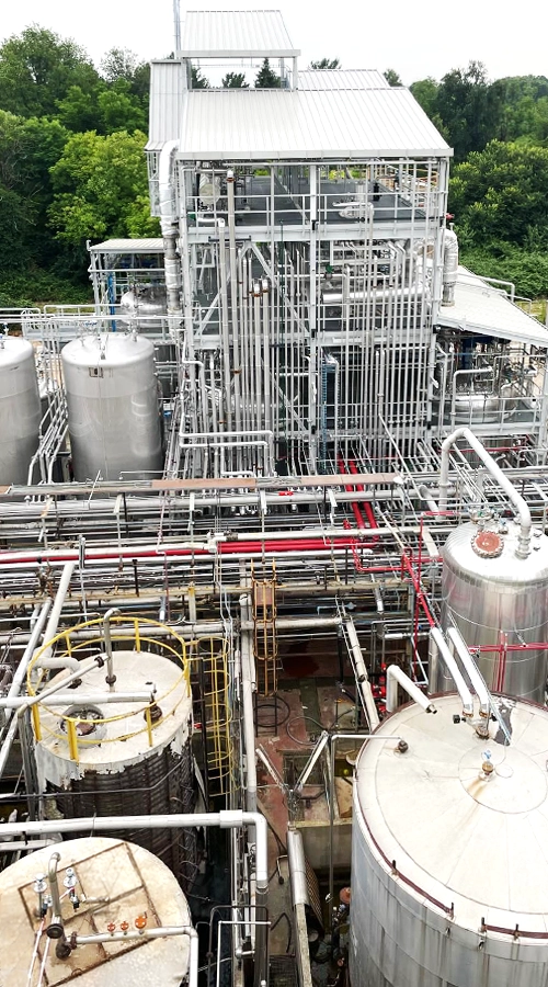 Impianto industriale per produzione resina con piping e serbatoi COIM 2005