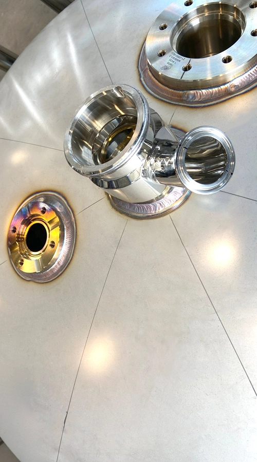 Saldatura TIG su acciaio inox con raccordi sanitari e finitura lucida COIM 2005