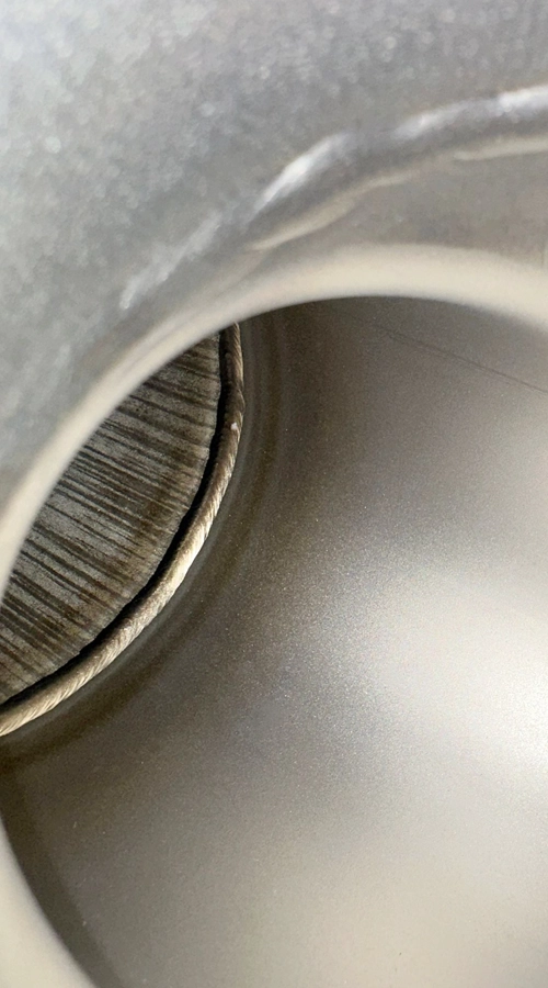 Dettaglio interno saldatura TIG su tubo in acciaio inox COIM 2005